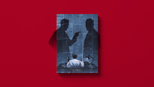 An illustrated faux book cover with a person sits at a desk in a dimly lit room, facing a wall covered in newspaper articles, with two large shadows of people looming behind, one pointing accusingly. The book sits on a red background.