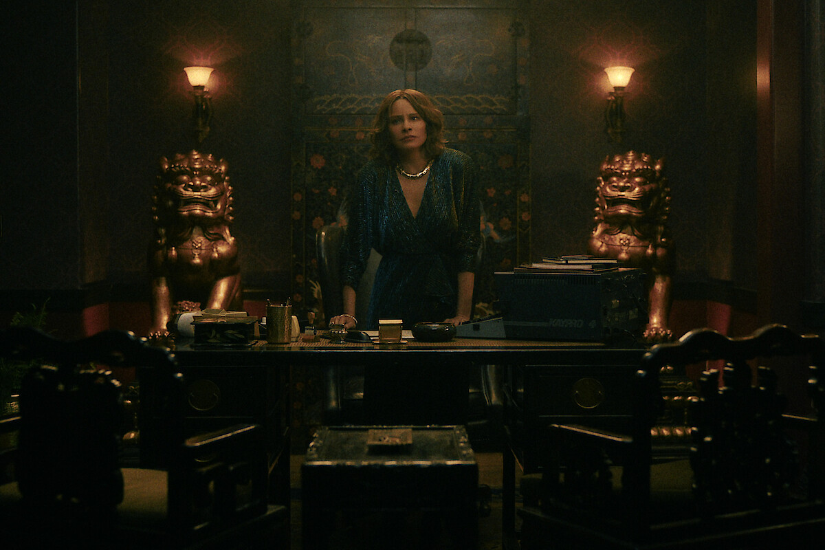 Sofia Vergara as Griselda behind a desk