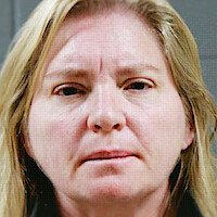 Two individual portraits of blonde women staring at the camera in mugshots