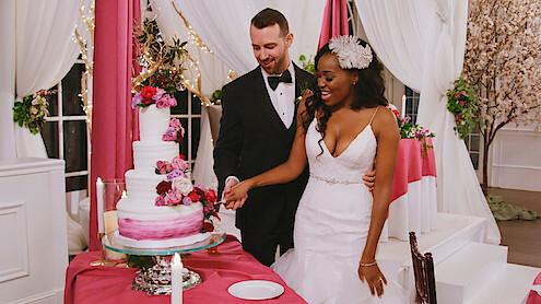 Lauren and Cameron cutting their wedding cake in 'Love Is Blind' Season 1.