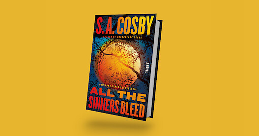 The image shows the thriller novel "All The Sinners Bleed" by S.A. Cosby with a suspenseful, atmospheric cover featuring dark branches against an orange moon, set on a plain yellow background, evoking a tense, moody tone.