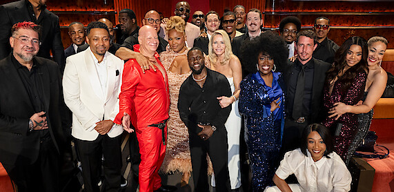  Big Jay Oakerson, Na'im Lynn, Jeff Ross, Dwayne Johnson, Lizzo, Draymond Green, Kevin Hart, Pete Davidson, Chelsea Handler, Shane Gillis, Sheryl Underwood, Tony Hinchcliffe, Tiffany Haddish, Regina Hall, dressed formally and colorfully.