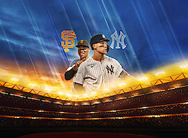 Two baseball players from the San Francisco Giants and New York Yankees pose in a brightly lit stadium with team logos and a dramatic evening sky in the background.