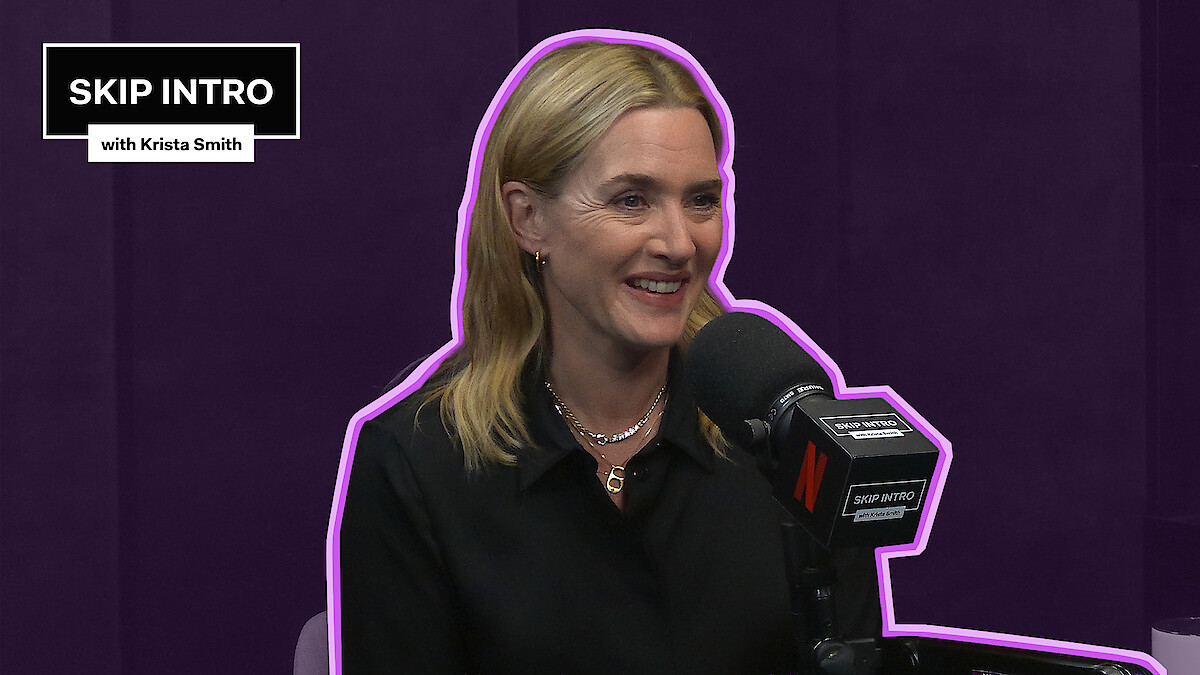 Kate Winslet smiles while speaking into a podcast microphone in a purple studio, outlined with a neon accent, with a “Skip Intro with Krista Smith” graphic in the corner.