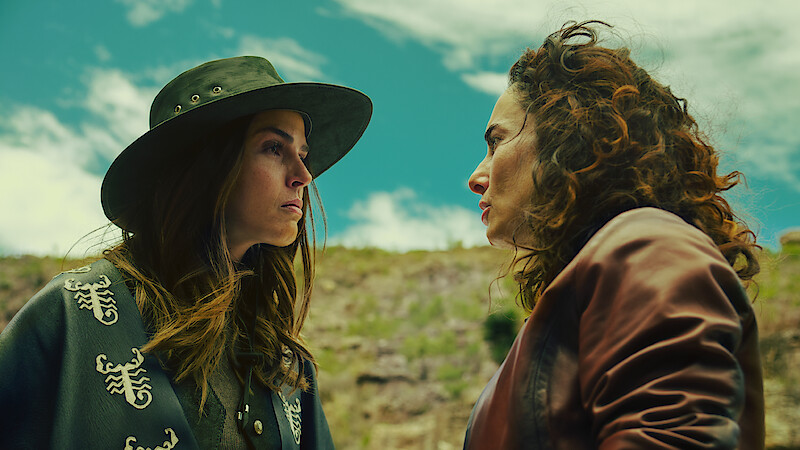 Claudia Alvarez as Antonia and Ana Serradilla as Perla look at each other angrily while outside in an image from 'Sisters' Feud.'