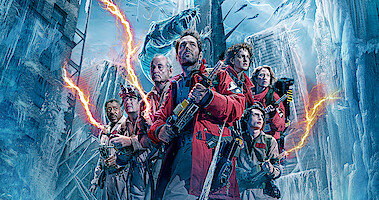 The cast of 'Ghostbusters: Frozen Empire' stand wearing their gear in a frozen city 