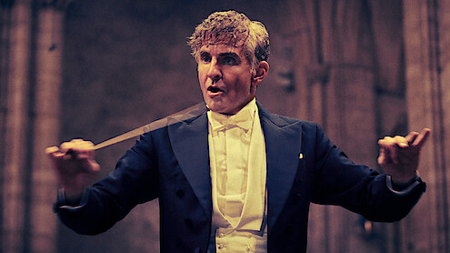 Maestro. Bradley Cooper as Leonard Bernstein (Director/Writer/Producer) in Maestro. Cr. Jason McDonald/Netflix © 2023.