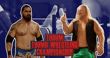 Shera and Cash Flo holding a thumbs up in front of a close up of 2 thumbs wrestling in a miniature ring.