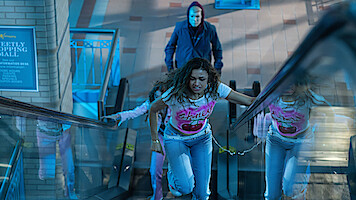 Madison Bailey as Lucy, Sydney Sabiston as Val and BJ Verot as The Slasher in 'Time Cut.'