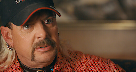 Card image: 7 of Joe Exotic’s Side Hustles, from Country Singer to Magician