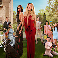 Group of elegant people posing outdoors in formal attire on a sunny day, with a large dog in the foreground, a mansion and champagne, lush green lawn, some taking selfies, creating a sophisticated and glamorous garden party scene.