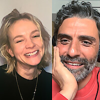 Carey Mulligan and Oscar Isaac smiling in a split-screen video call; each in their own indoor setting.