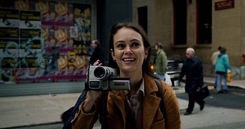 A close up of Melody with her handheld video recorder