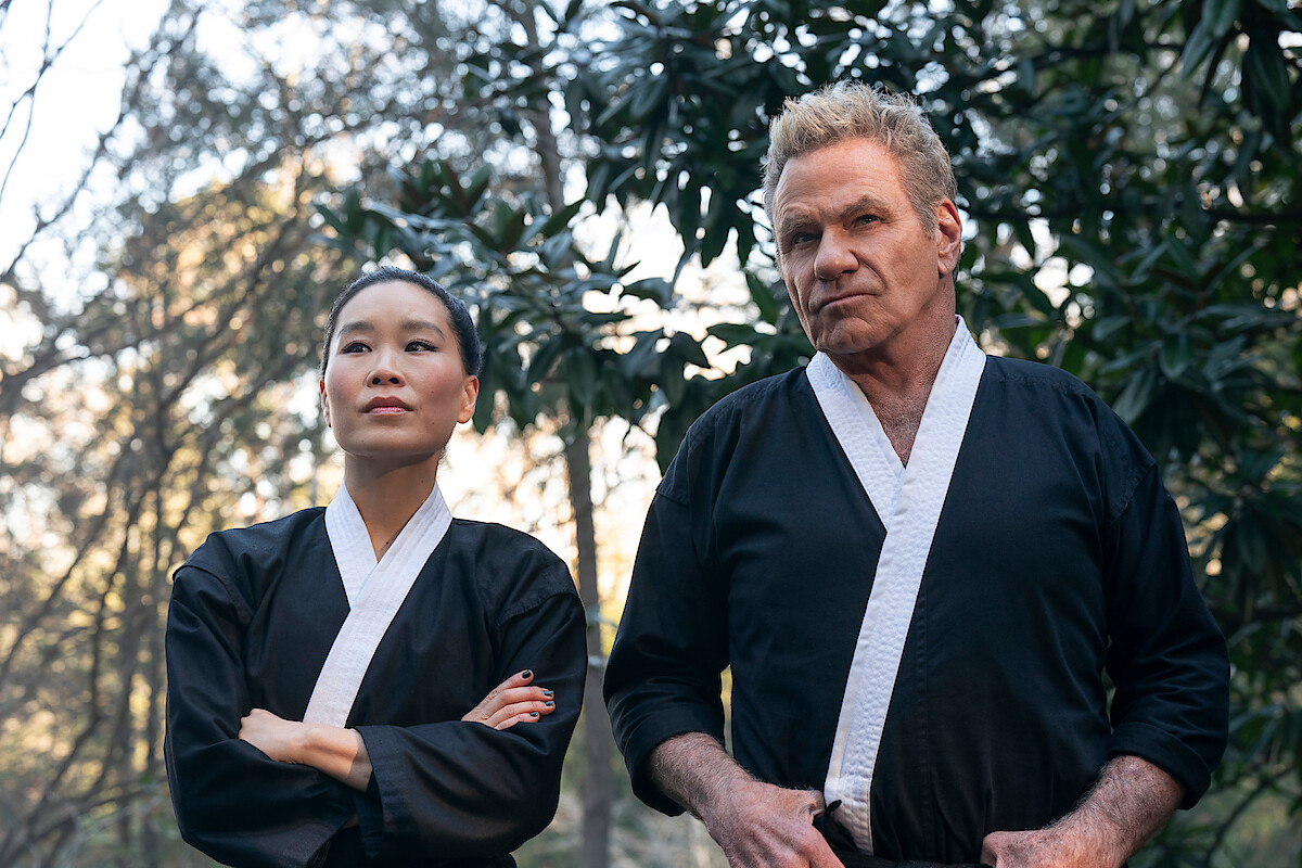 Alicia Hannah-Kim as Kim Da-Eun, Martin Kove as John Kreese stand together in Season 6 of 'Cobra Kai'