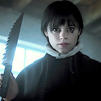 Jenna Ortega as Wednesday Addams holds a large knife in 'Wednesday' Season 2