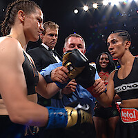Katie Taylor touches gloves with Amanda Serrano.