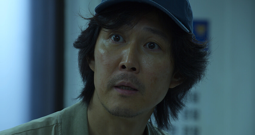 A man looks distressed in Squid Game