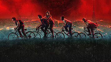 Key art for 'Stranger Things' 5 features the kids riding bikes under a red stormy sky.