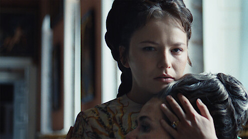 Devrim Lingnau as Elisabeth von Wittelsbach holds a woman's head to her chest in Season 2 of 'The Empress'