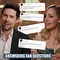 Benjamin Hollingsworth and Zibby Allen holding card with questions from fans stacked between them.