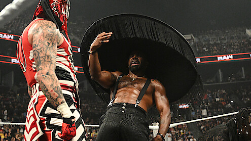 Xavier Woods gestures towards Penta in the ring.