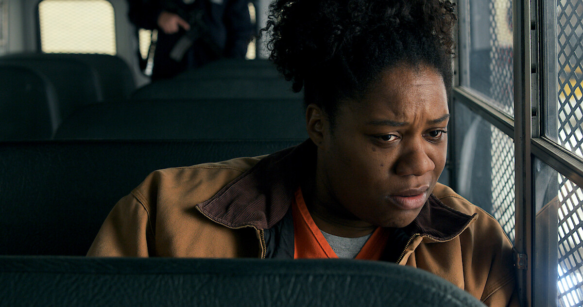 Adrienne C. Moore as Cindy sitting on a bus in Orange Is the New Black Season 6.