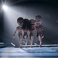 The puppet versions of Anthony Keddis, John Frusciante, Flea, and Chad Smith onstage.