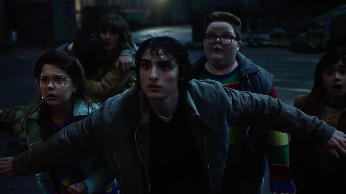 Winona Ryder as Joyce Byers, Finn Wolfhard as Mike Wheeler and Jake Connelly as Derek in 'Stranger Things 5'