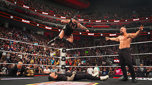 Bronson Reed comes down with a Tsunami to Roman Reigns while Bron Breakker looks on during Monday Night RAW at Little Caesars Arena on July 28, 2025 in Detroit, Michigan