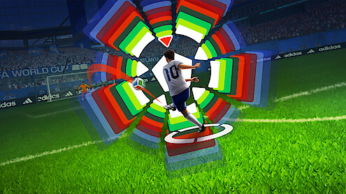 Soccer player in white jersey taking a shot on goal in a stadium, with colorful digital graphics showing trajectory and power settings, crowd and banners visible in the background.