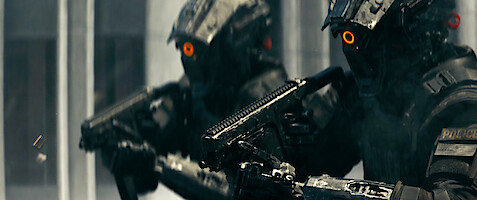 Two policemen in full body armor hold guns in 'Code 8'