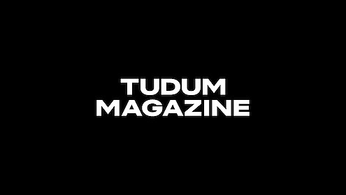 Tudum Magazine logo in white on a black background.