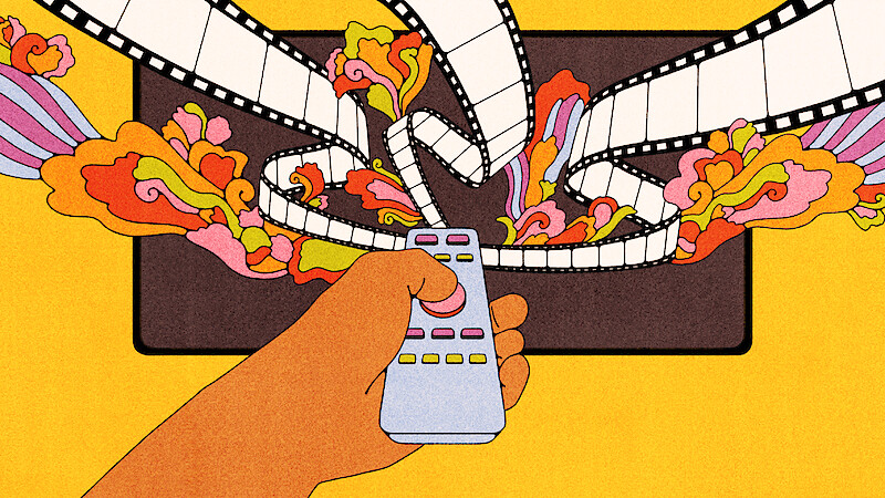 Hand holding a remote control in front of a TV with colorful film strips and abstract shapes flowing out of the screen on a yellow background, representing creativity or entertainment.