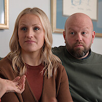 A couple listens to Dr. Swan