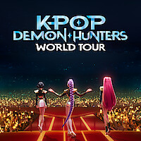 Three animated female performers stand on a lit stage facing a cheering crowd under the text "K-Pop Demon Hunters World Tour" during a night concert event.