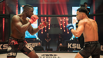 Bosh and Melvin Boomer square off in the ring in a scene from the series 'The Cage.'