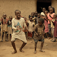 A group of children dancing. 