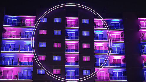 An exterior view of 'The Circle' apartments from Season 6.