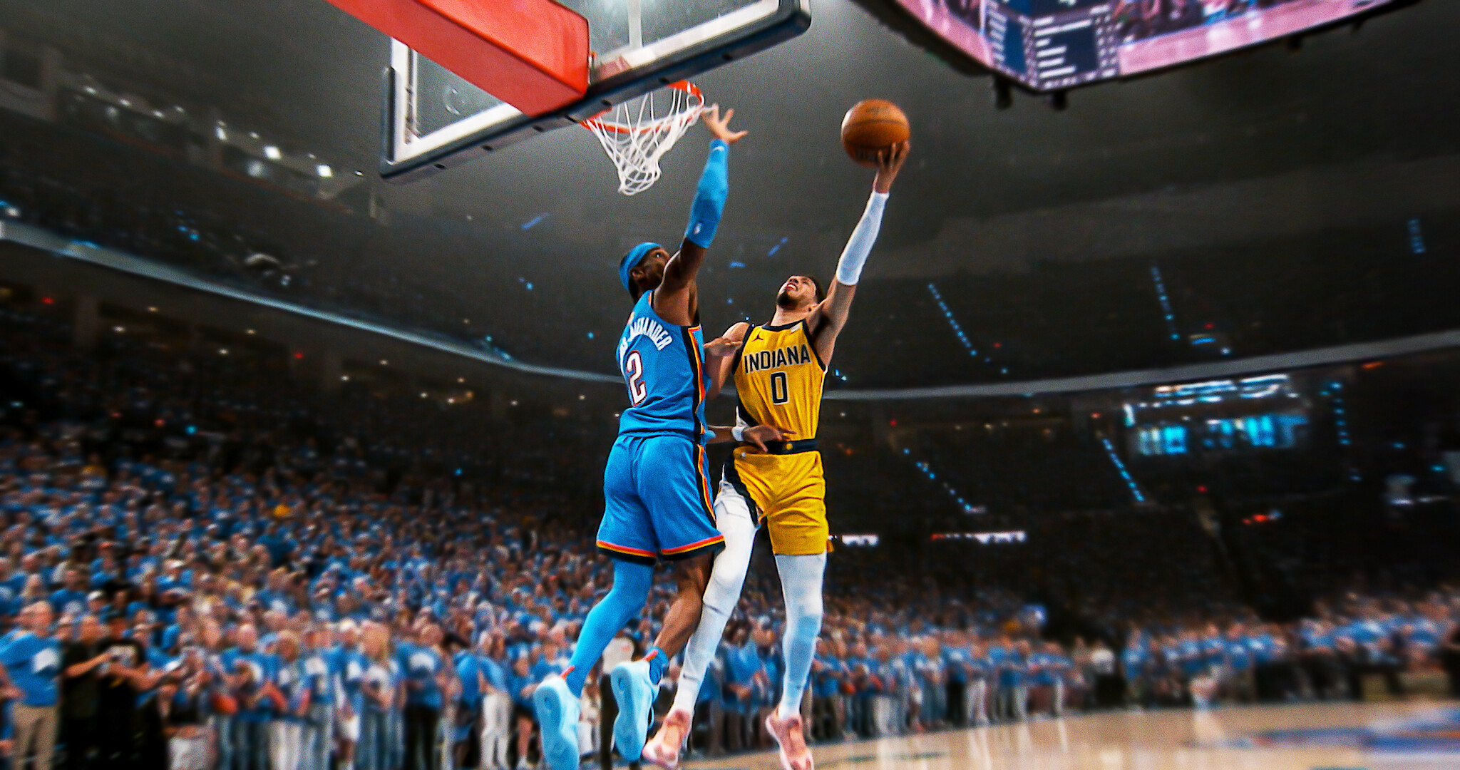 Starting 5 - Two basketball players at the hoop