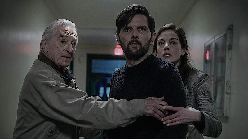 The Whisper Man. (L-R) Robert De Niro as Peter Willis, Adam Scott as Tom Kennedy and Michelle Monaghan as Amanda Beck in The Whisper Man. Cr. David Lee/Netflix © 2026
