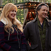 Alexandra Breckendridge as Mel and Martin Henderson as Jack embrace each other in 'Virgin River'