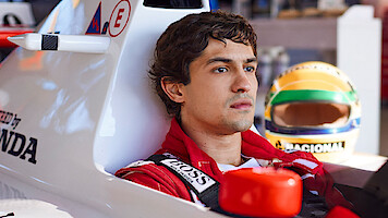 Gabriel Leone as Ayrton Senna sits in a race car in 'Senna'