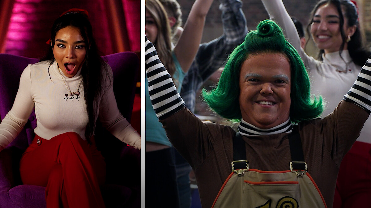 Contestant with Wonka's Golden Ticket next to an Oompa Loompa