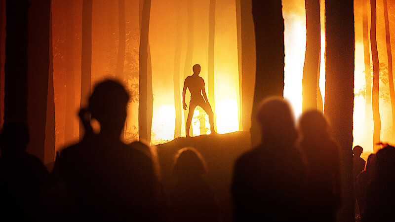 A shadow figure stands in a forest backlit by golden light in Season 1 of 'Joko Anwar’s Nightmares and Daydreams'