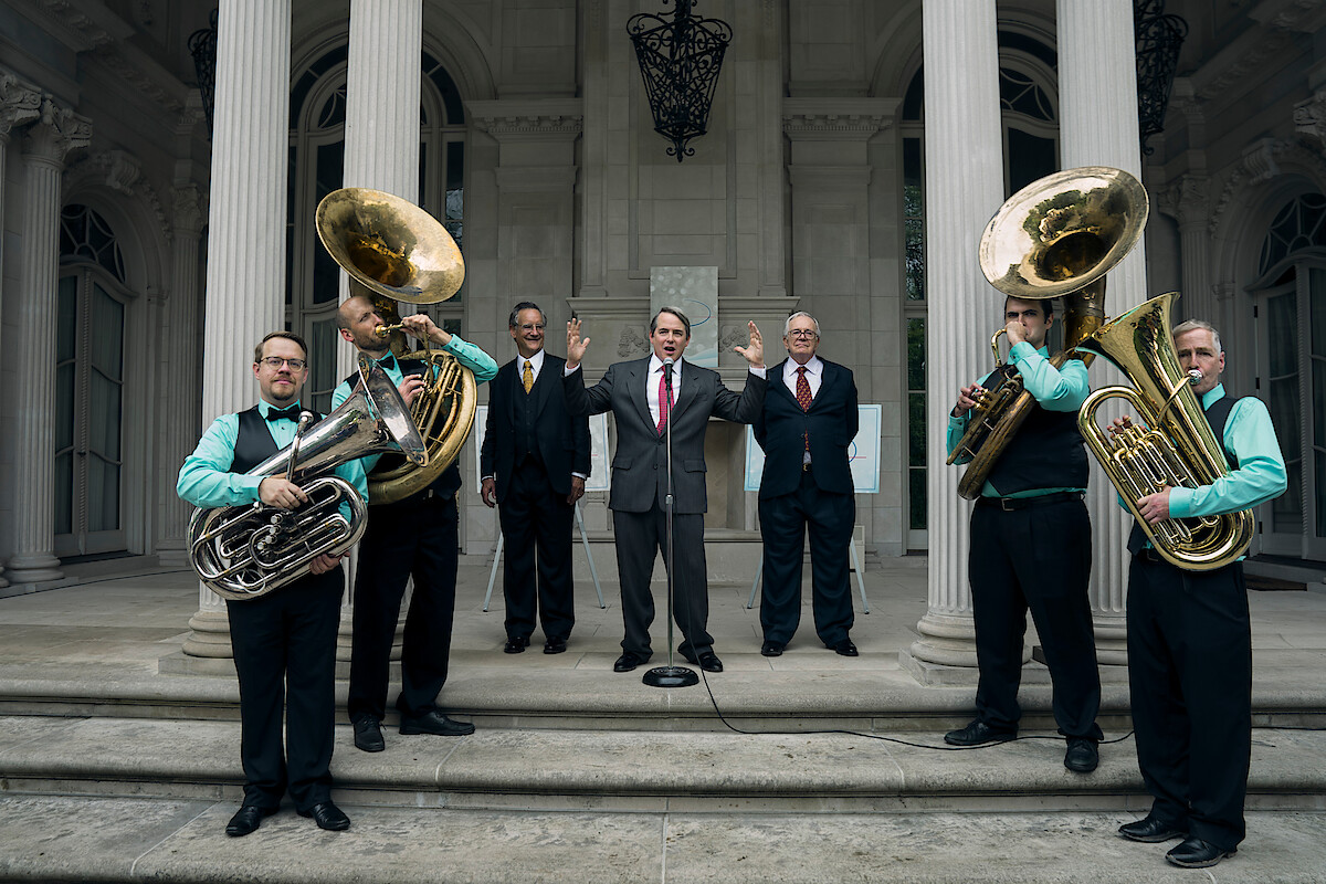 a band playing in front of a building