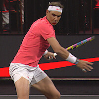 Image of tennis player Rafael Nadal playing tennis.