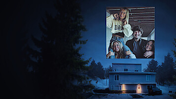 A house at night in a snowy, forested area with a lit front door; an inset shows four smiling young adults indoors, posing together and appearing cheerful.