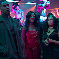 Three well-dressed people in a nightclub with neon lighting, looking intently ahead. Background features shirtless male performers on platforms and a lively crowd. The setting is vibrant and energetic.