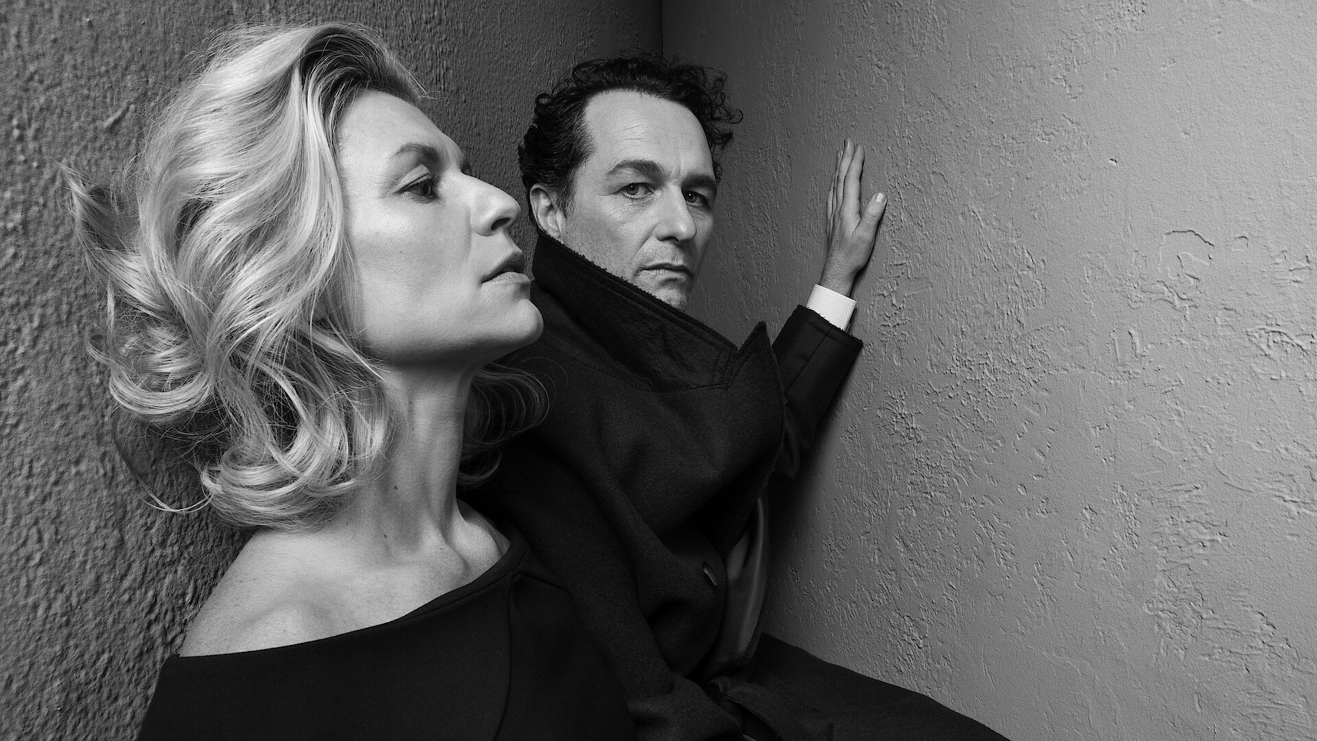 Claire Danes and Matthew Rhys pose for the camera wearing all black