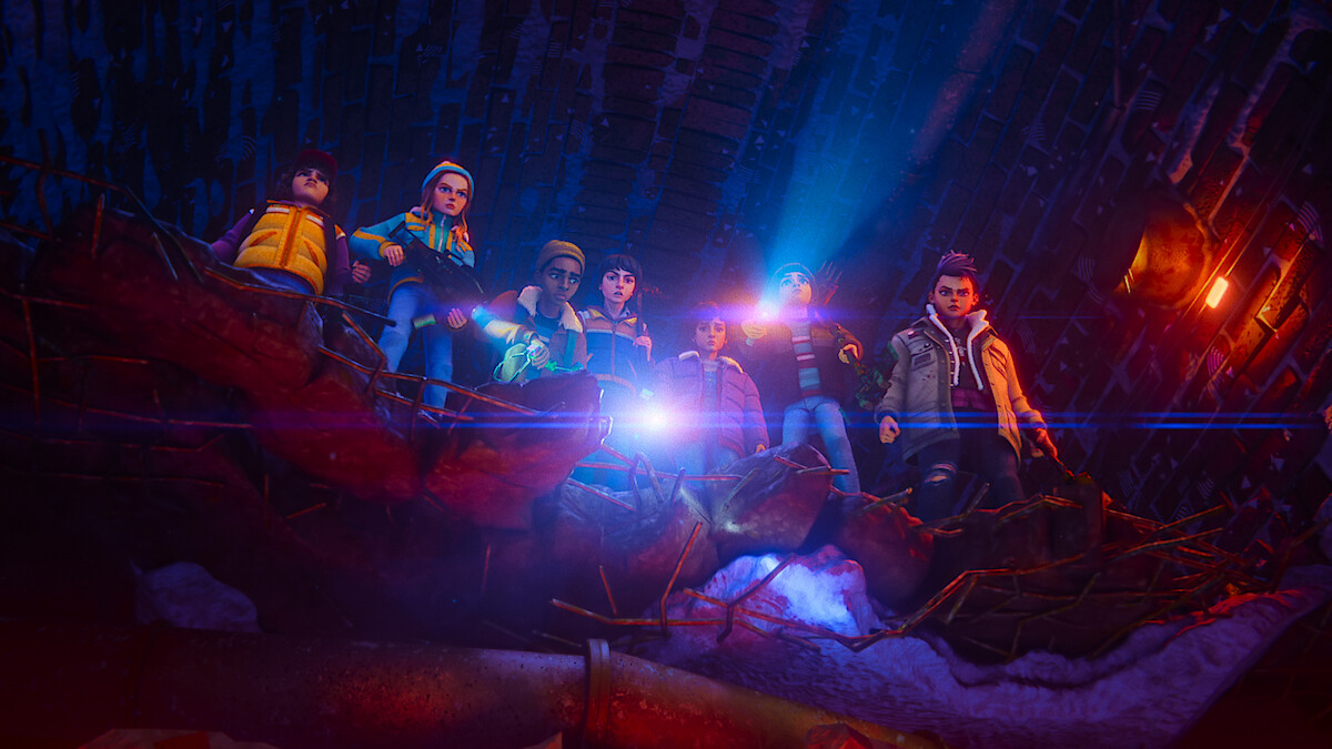Seven animated kids stand together on a broken ledge in a dark tunnel with rubble, snow, and bright flashlight beams, appearing cautious or curious in the mysterious, dramatic environment.